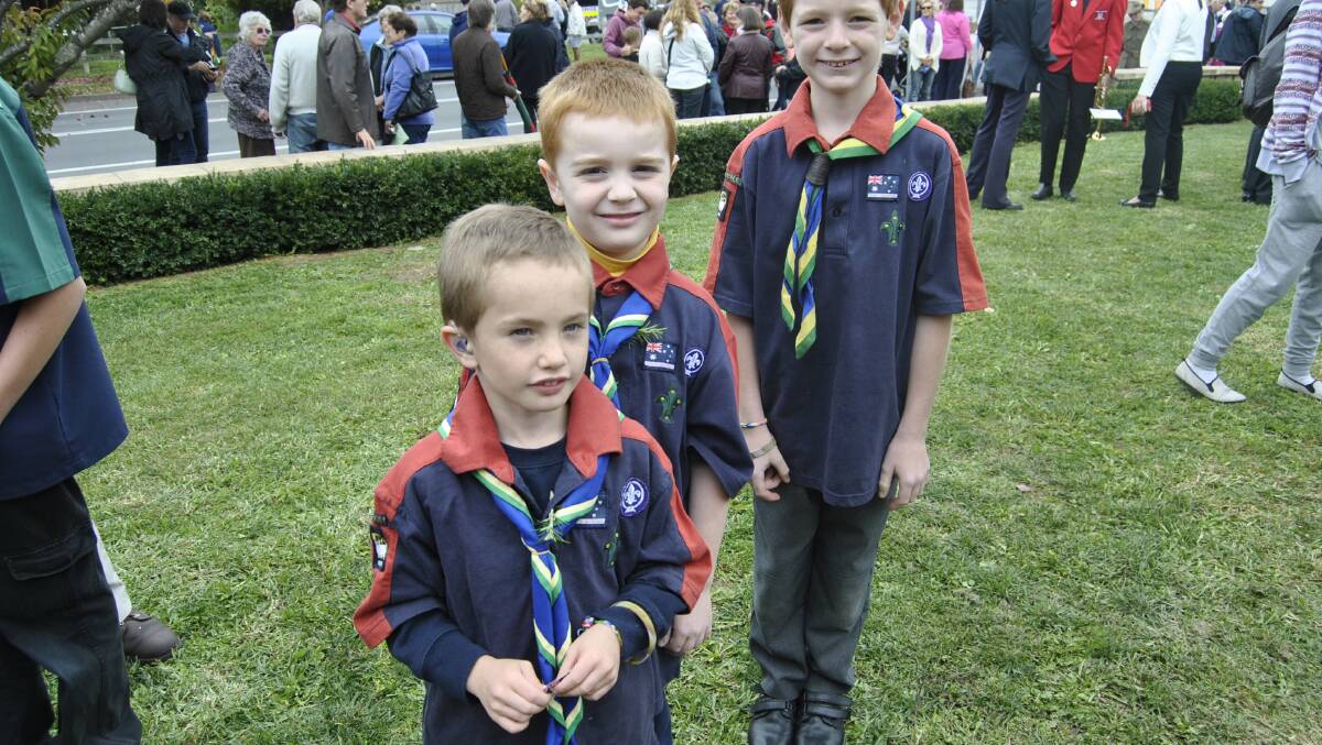 Nicholas Harper (6), James Orford (6) and Jackson Harrison (7) after the ceremony at Moss Vale. Photo by Dominica Sanda