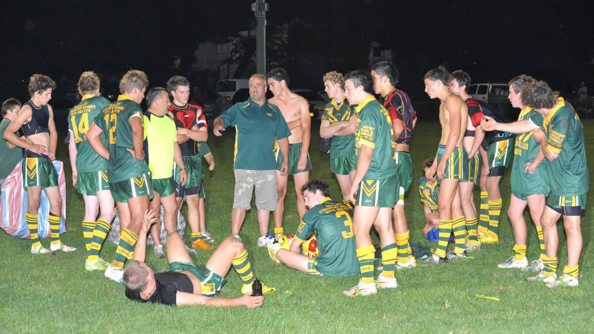 Mittagong Lions in a team talk.