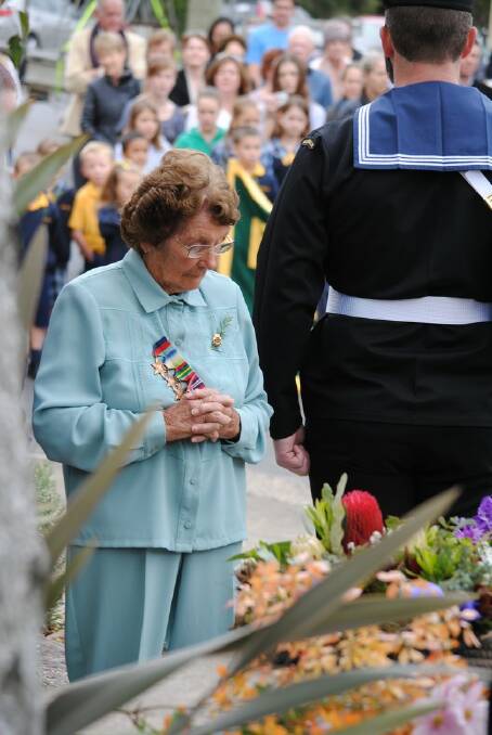 Bundanoon resident Audery Petersen pays her respects at the Bundanoon Anzac Service. 
