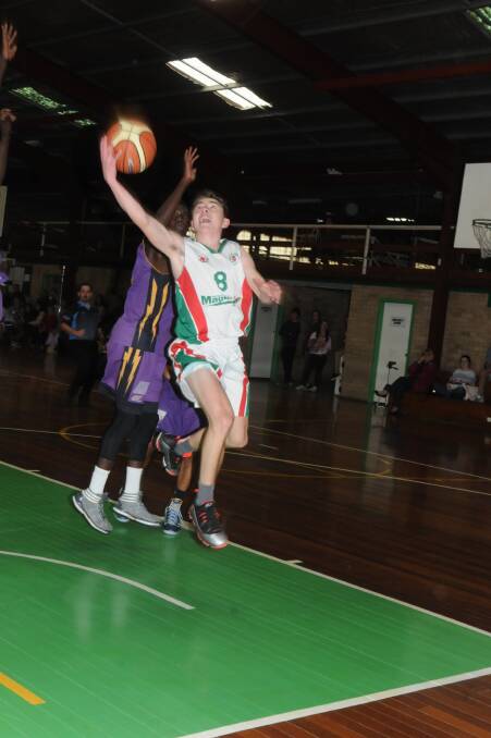 Billy Campbell goes up for a basket in Moss Vale Magic's 87-66 loss to Blacktown West Storm. Photo by Lauren Strode