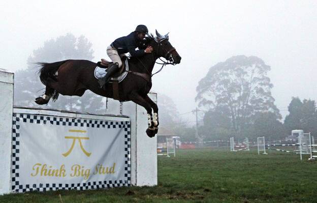 Michael Cross riding Little Bear clear a jump during the recent Southern Highlands Showjumping Championships at Robertson. Photo: Julie Powell
