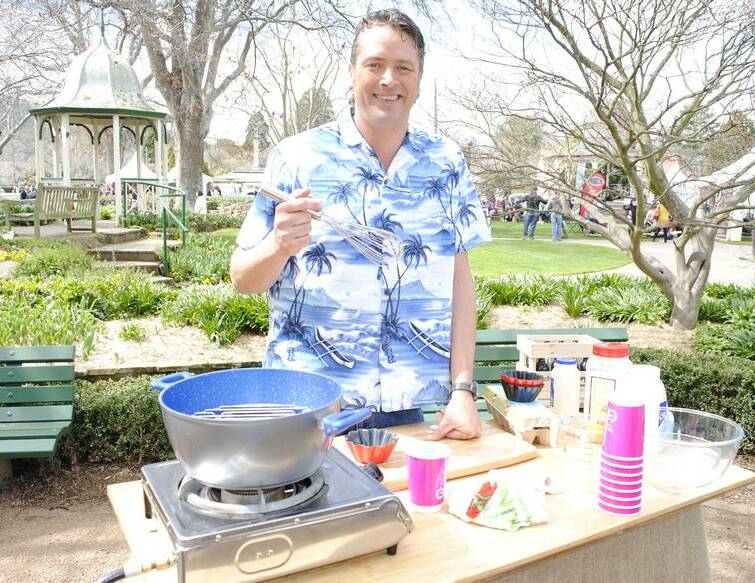 Alive and Cooking host James Reeson takes a break from filming of an episode at the Southern Highlands Food and Wine Festival on Saturday. James said he was loving the festival at Corbett Gardens. Photo by Josh Bartlett