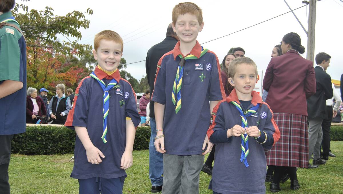 Nicholas Harper (6), James Orford (6) and Jackson Harrison (7) after the ceremony at Moss Vale. Photo by Dominica Sanda