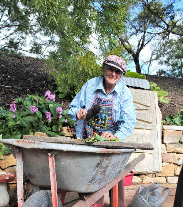 Rosina Buckman demonstrates how to chop up a healthy compost. Photo by Dominica Sanda