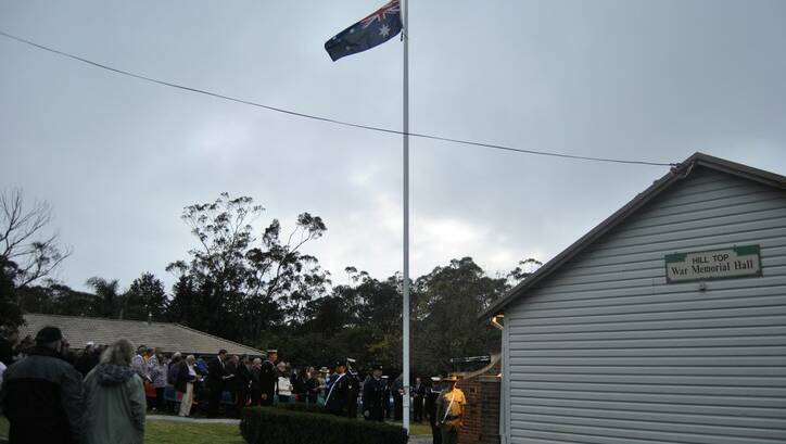 Raising of the flag at the Hill Top dawn service. Photo by Dominica Sanda