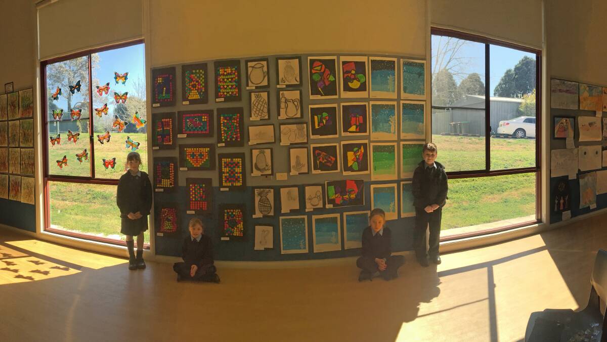 Year 2 student artists Sarah, Steffi, Lillian and Caspian from Mrs Smith's class at St Paul's Catholic Primary School, Moss Vale, art show fundraiser. Photos Ainsleigh Sheridan