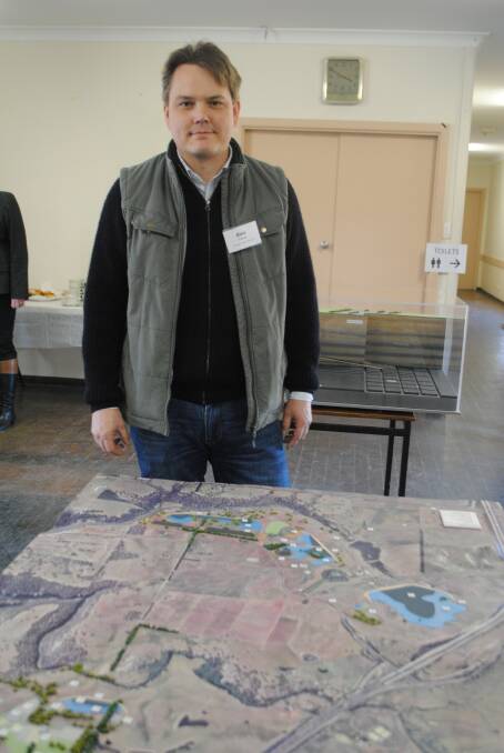 Hume Coal mine planning manager Alex Pauza with one of the displays at a Hume Coal community information session. Photo by Dominica Sanda