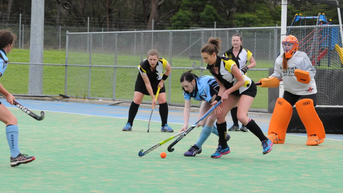 Robertson's Jennifer Menzies puts all her effort into getting posession of the ball during the game against Bowral. Photo by Lauren Strode