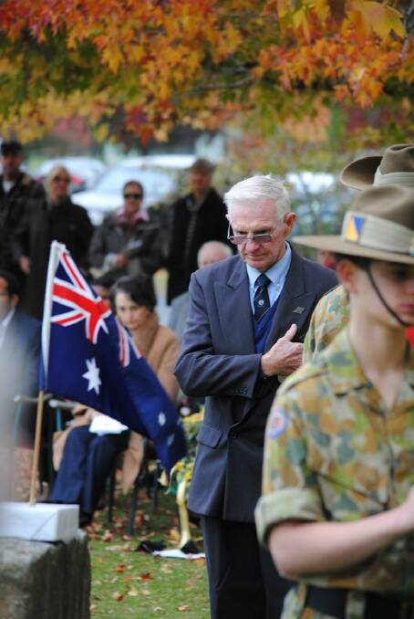 David Babbage pays his respect at the Cenotaph at the Sutton Forest Anzac Service. 