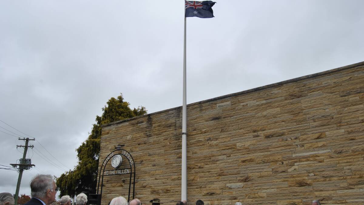 Raising of the flag at Moss Vale Services Club. Photo by Dominica Sanda