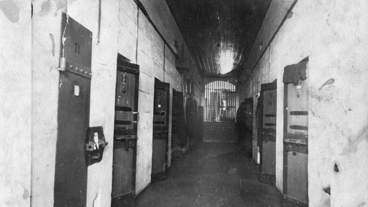 CELL BLOCK: One of Berrima Gaol’s original wings with cedar doors and iron grille partition at end, c1890.