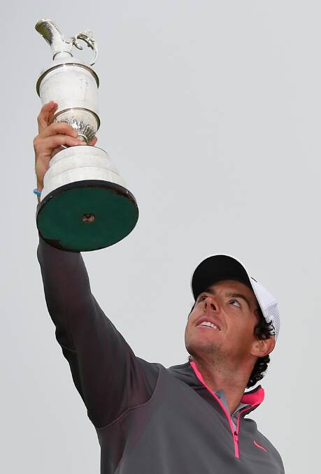Rory McIlroy holds the Claret Jug aloft after his two-stroke victory at the 143rd Open Championship. Photo: FDC
