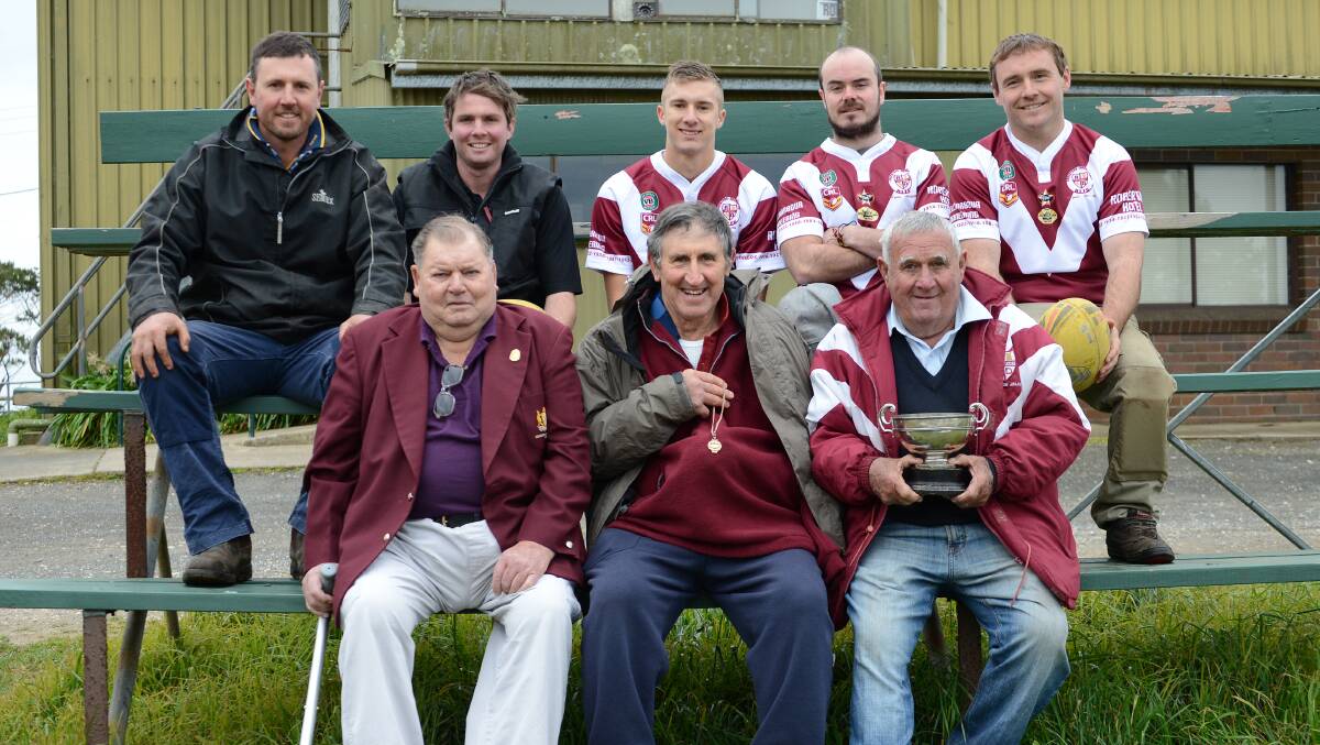 (front row) Bruce Noble, John Whatman showing off William Missingham's Premiership winning medal, Nathan Waters holding the 1914 Premiership trophy, (back row) Brad Whatman, Phillip Whatman, Clay Caines, Royce Harris and Doug Tilly. Photo by Roy Truscott