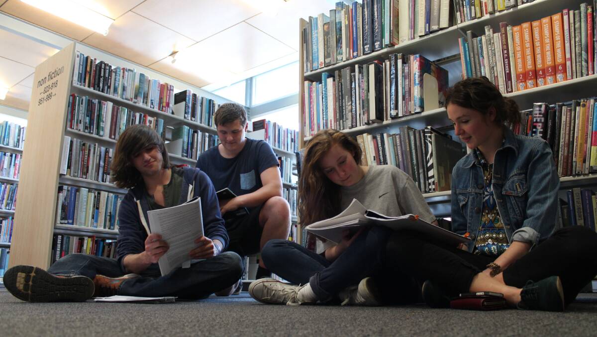 Bowral High School students Zach Bertram, Rory McDonald, Ashleigh Millward and Lulu Talbot study for their HSC exams in the Bowral Central Library. Photo by Megan Drapalski