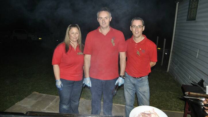 Catharine Fardell, David Himdley and Andrew Veitch helping out at the barbecue. Photo by Dominica Sanda