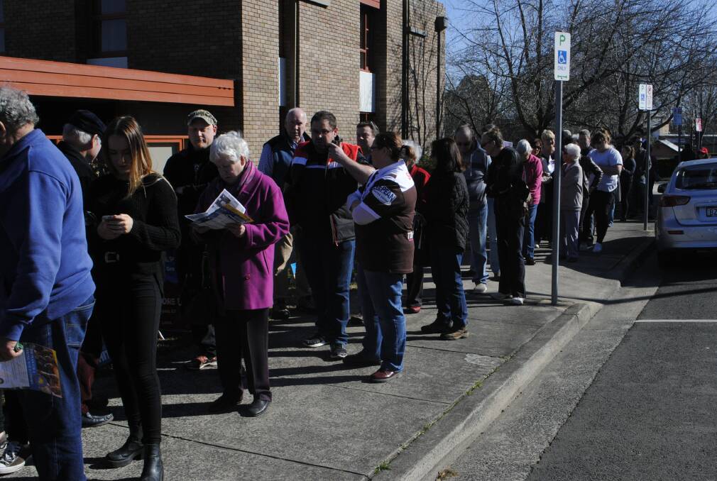 Some of the people who were lined up for the election booth in Moss Vale at lunchtime on Saturday. Photo by Josh Bartlett