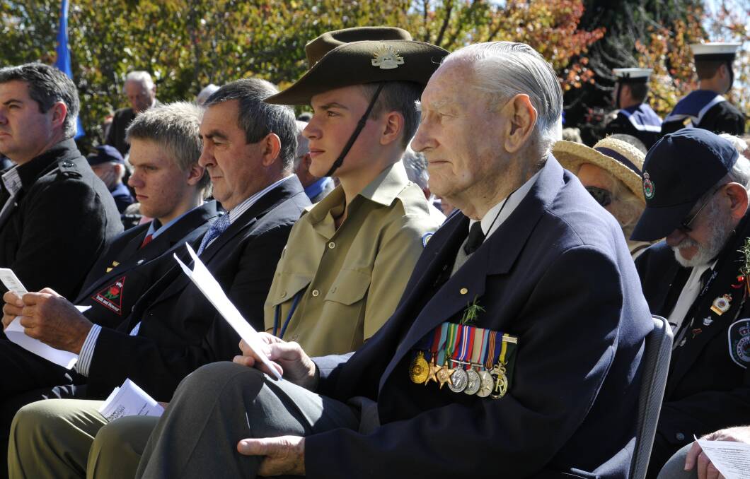 Owen Edwards OAM and Chevalier Cadet Brendan Hans attend last year's Anzac Day ceremony in Moss Vale. The 2014 program for the Southern Highlands has been released. Photo: Roy Truscott 