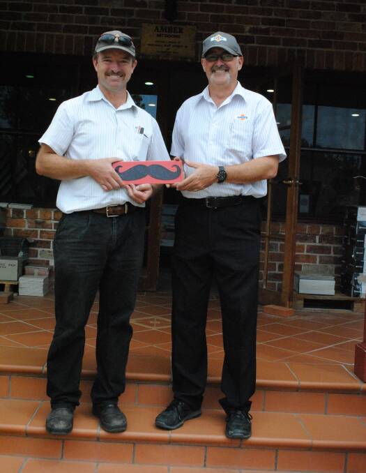 Adam Traynor and Wayne Johnstons with their "tile mo" for Movember. Photo by Dominica Sanda