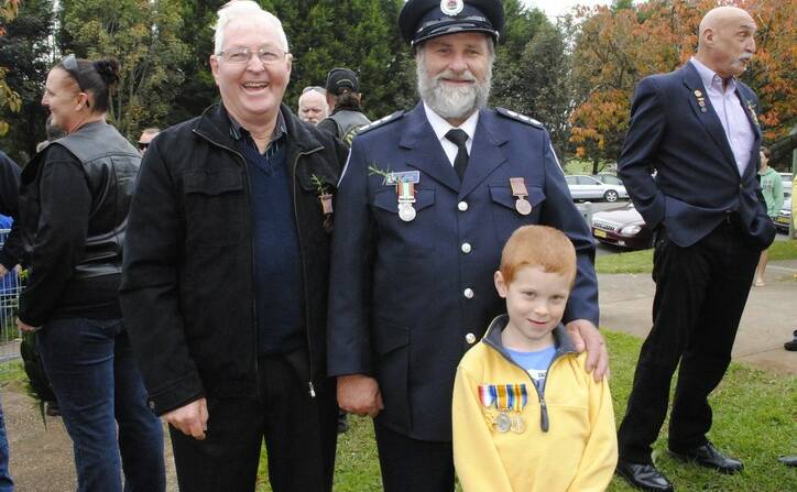 John Johnston, Phil Moore and his grandson Callum Brach wearing his great,great grandfathers medals at the Robertson Anzac Service.