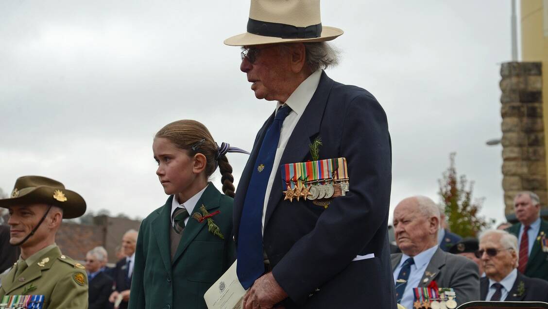 A Rat of Tobruk Ernie Walker, 98, from Penrose with his great grand daughter Matilda Walker at the Mittagong Anzac service. Photo by Roy Truscott