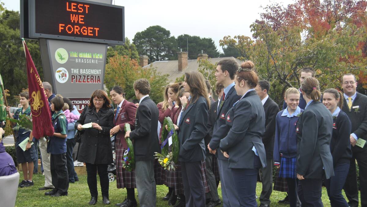 Crowds gathered in front of Moss Vale Services Club for the ANZAC Day service. Photo by Dominica Sanda
