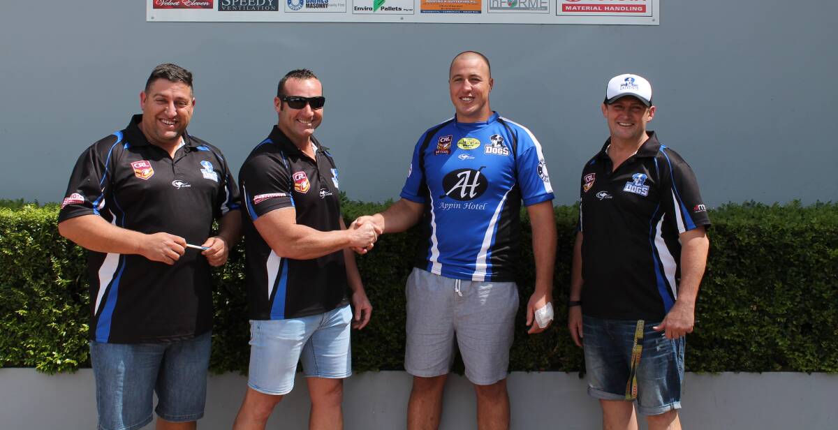 Appin Dogs president Rob Dreis, first grade coach Dane Wooden and club vice-president Peter Hambly welcome recruit Bryce Gibbs (second from right).     						             Photo supplied