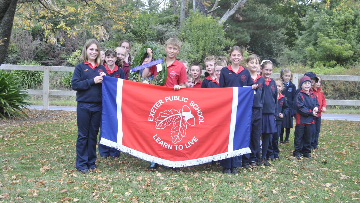 Exeter Public School stand proud with their banner at the Exeter march and service. Photo by Dominica Sanda