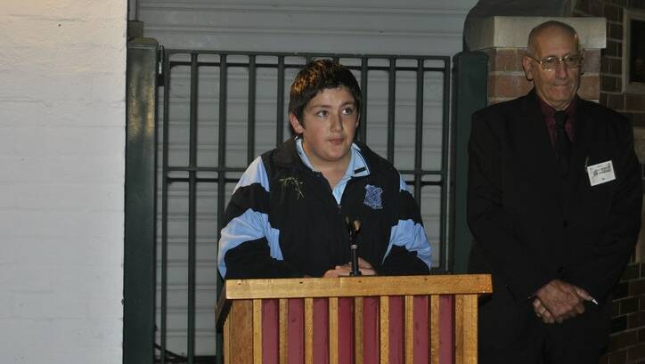 Lachlan Davis from Hill Top Public School gives an ANZAC address at the Hill Top dawn service. Photo by Dominica Sanda