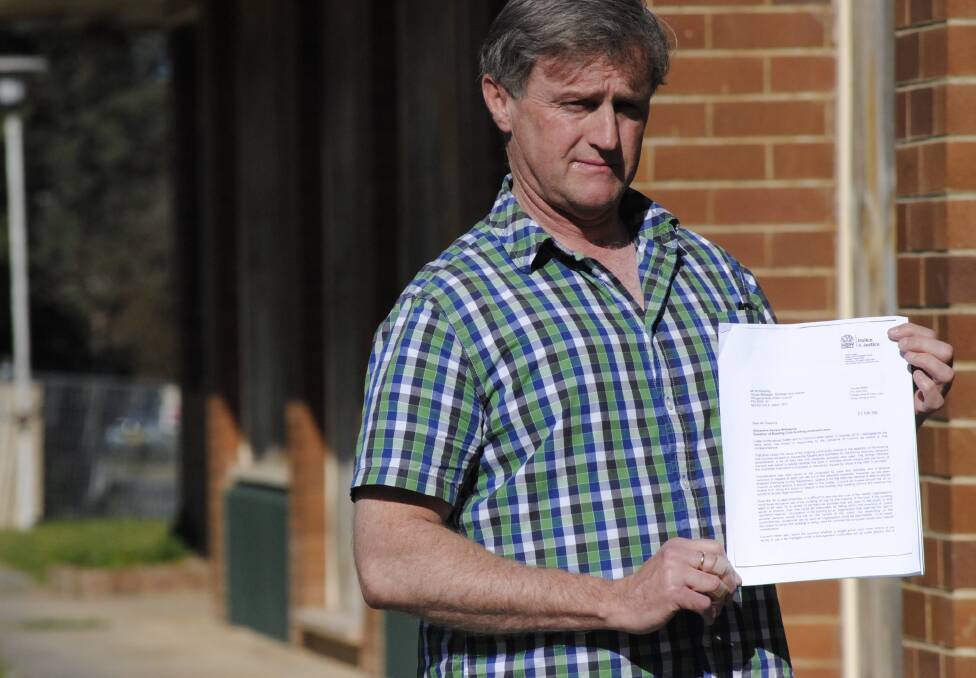 Mittagong resident Tim McCartney with the latest response from the Attorney General in regards to the fate of the Mittagong Bowling Club. Photo by Dominica Sanda