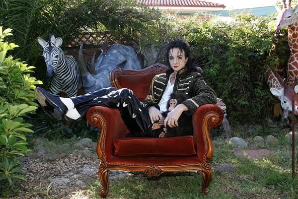 MOONWALKER: Jason Jackson sits in his ever-growing backyard Neverland at his Narellan Vale home. Photo supplied