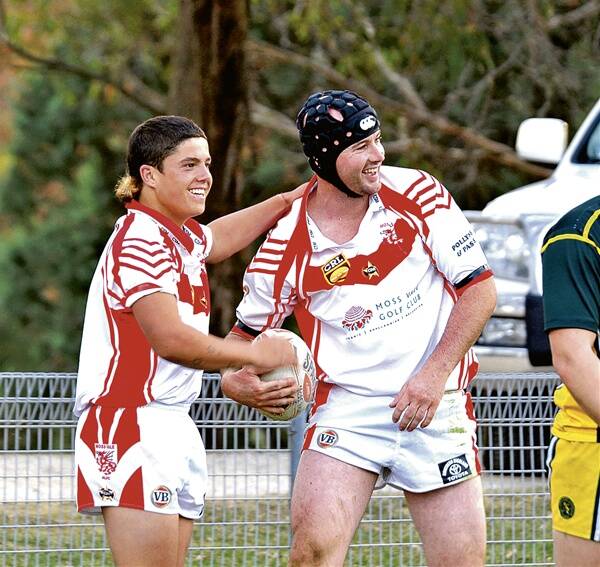 GOOD DAY: Moss Vale Dragon Dan Drewe (right) celebrates with Brad Meulaman after notching up 30 points in Moss Vale’s 74-0 thrashing of All-Saints.
