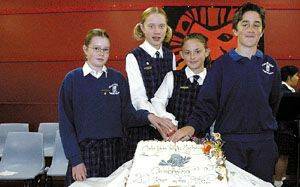 Celebrating education, and celebrating a birthday...Colo Vale Public School SRC representatives Ashley Sandor, Gabrielle Young, Monique Mansfield and Nicolas Tipping cut the cake to celebrate the school's 20th anniversary on Public Education Day on Thursday.
