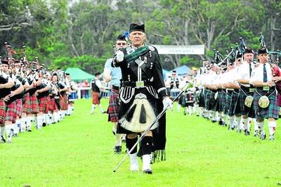 Gavin Kearney leads the pipe bands on to the field at Brigadoon yesterday. 	Photo by Roy Truscott