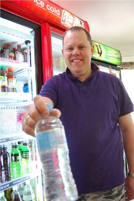 GONE: Grant McIntosh of Bundanoon Supermarket sold his last commercially bottled water this week as Bundanoon prepares to become Australia’s first bottled water-free town. Photo by Robyn Murray