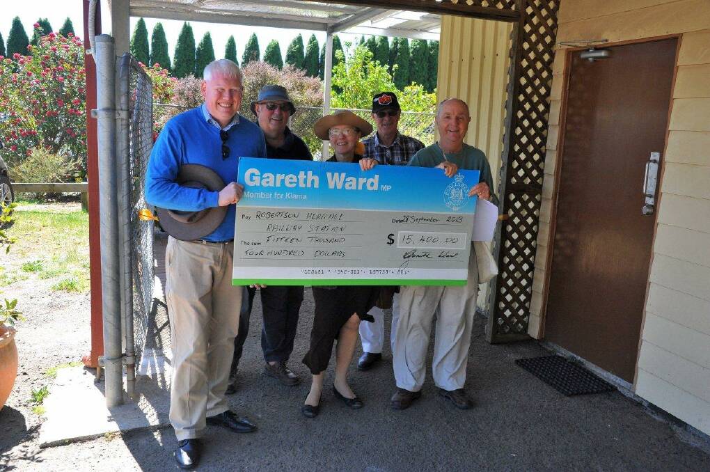 Member for Kiama, Gareth Ward presented a cheque of $15,400 to the RHRS. Photo supplied