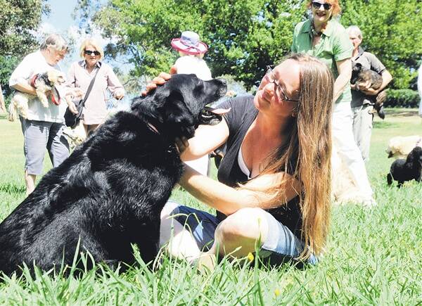 LET US BE FREE: Dog owner Alexandra Bruveris with her beloved Smokey in Seymour Park, Moss Vale.