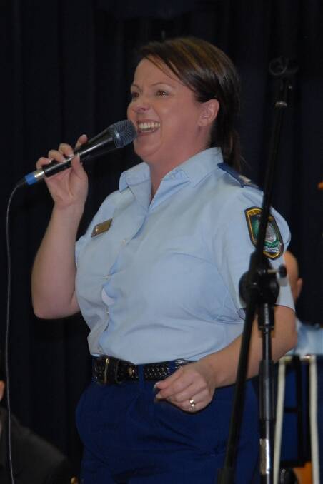 Special Constable Belinda Adams with the NSW Police Band entertained the audience in Bowral Memorial Hall yesterday.