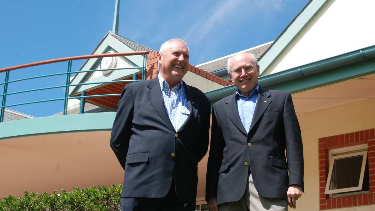 Moss Vale Liberal branch president Michael Ball, pictured with former Prime Minister John Howard in 2009, says there should be no party involvement in the council. 	File photo