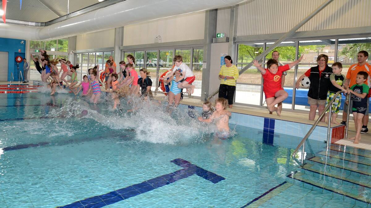 These children become the first to swim in the new Moss Vale pool. Photo by Roy Truscott
