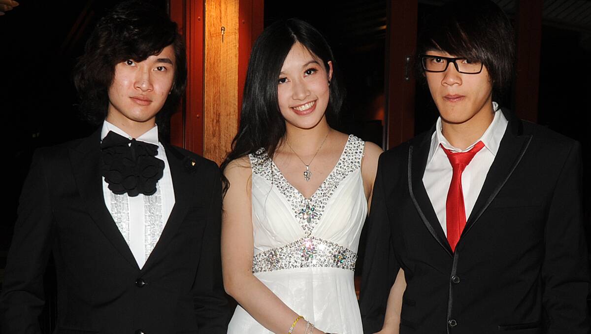 Isaac Huang, Stephanie Ip and Wynton Lee are all dressed up in their best formal attire.