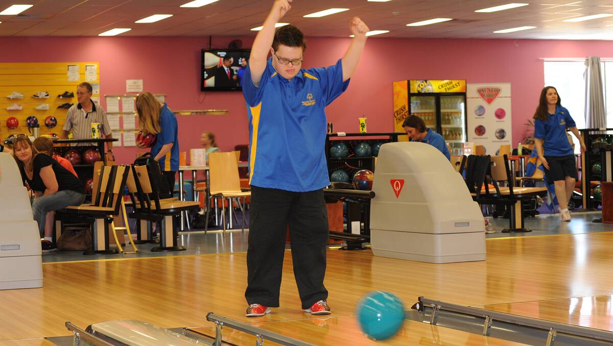 Brendan Kane shows his great form in letting rip with his bowling ball.