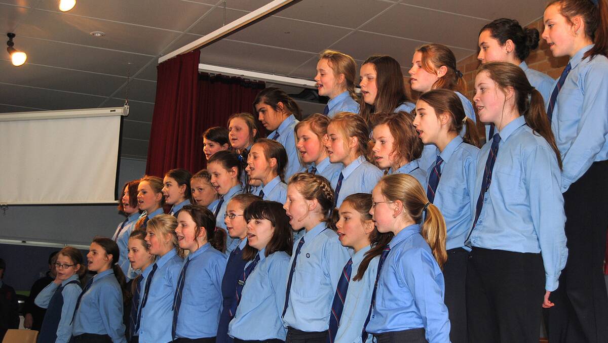 St Michaels senior girls choir perform for their special guests on grandparents day at the Mittagong school.  Photos by Andrea Mikic