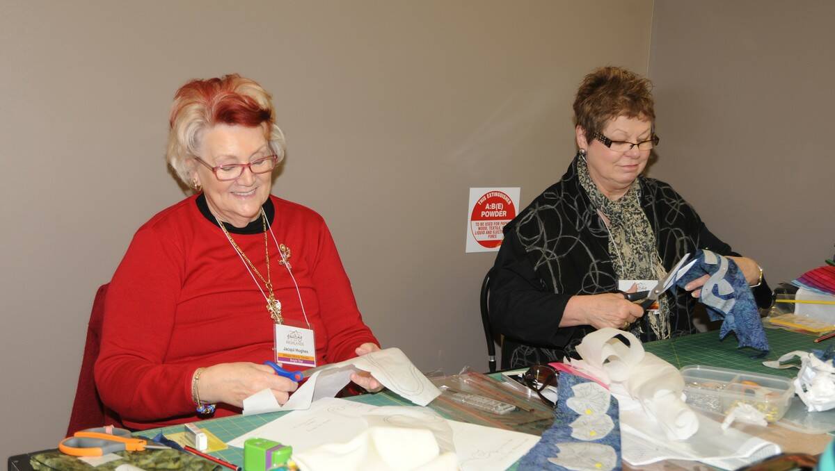 Working on thier quilts is Jacqui Hughes and Lindsay Ferguson.