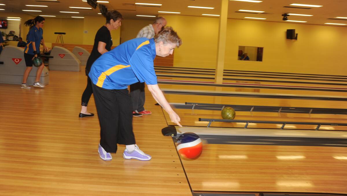Cherrie Isbister lets go of the bowling ball.