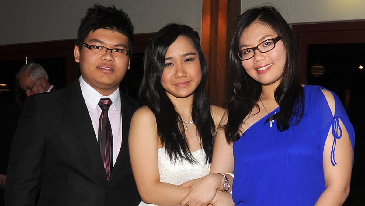 Alvin Yap with Prita Surya and Anh Chau-Tran showing the excitment to be at their formal.