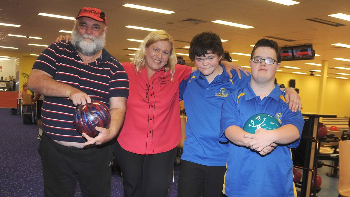 Terry Mulhall, Liam Dredge and Brendan Kane with a very happy Diane McAusland of the Highlands Tenpin.