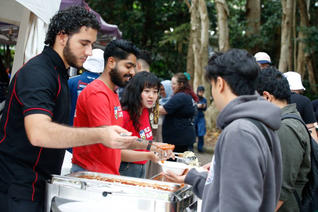 University of Wollongong staff and volunteers give out free food samples at O-Week, February 19, 2024. Picture by Anna Warr
