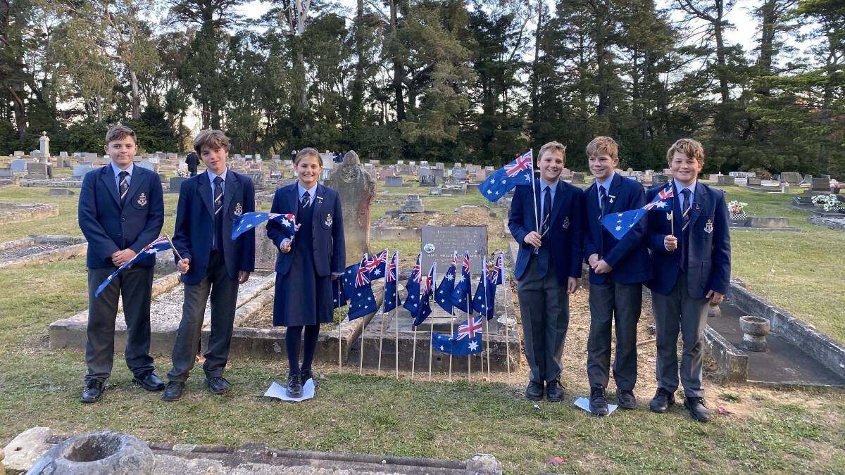 Tristan, Oliver, Claudia, James, Alexander and Saxon erected flags alongside their classmates. Photo: Briannah Devlin