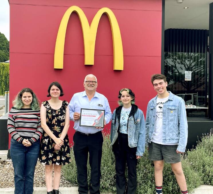 Left to right: Ivy, Milly, Jess and Zach presented Graham Marcolin (middle) with a certificate of appreciation for his ongoing support to the Wingecarribee Vocal Muster. Picture: Supplied 