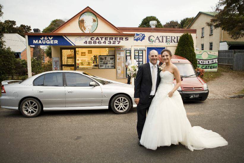 John with his daughter Nicole in front of the Burrawang store. Picture: Supplied 